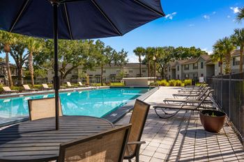 Our apartments have a resort style pool with tables and chairs